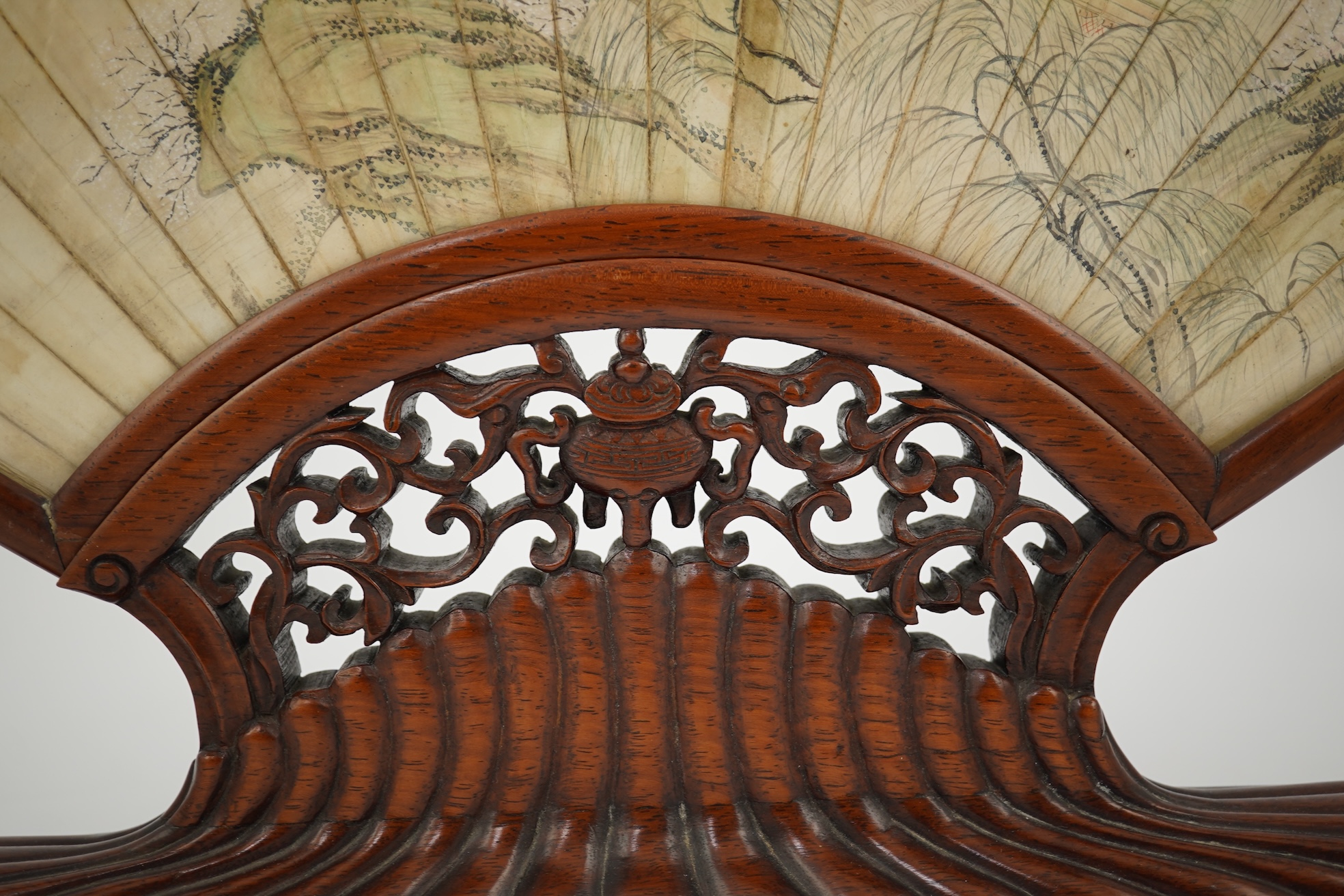 A Chinese painted leaf fan and hardwood stand, late 19th century